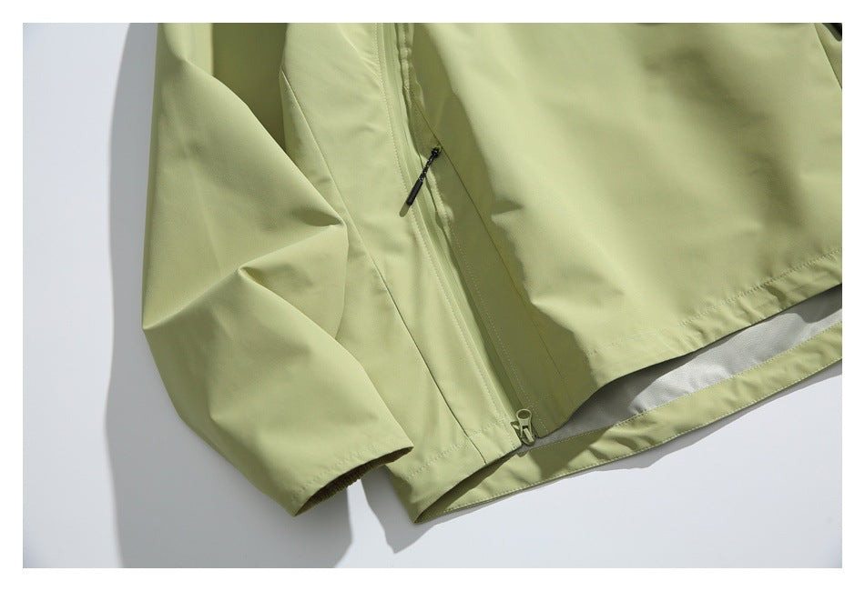 Close-up of the jacket's lower side zipper pocket, sleeve cuff, and hem.