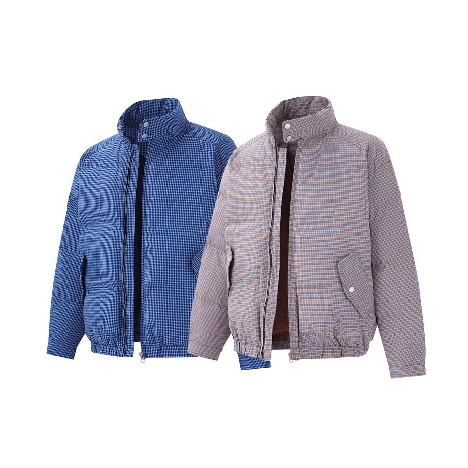 Two checked zip jackets shown from the front, one blue and one taupe, with stand collars and snap details.