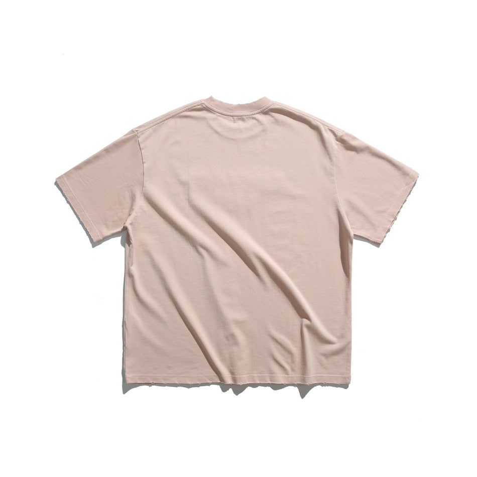 Back view of a pale blush-pink short-sleeve crew-neck T-shirt on a white background.