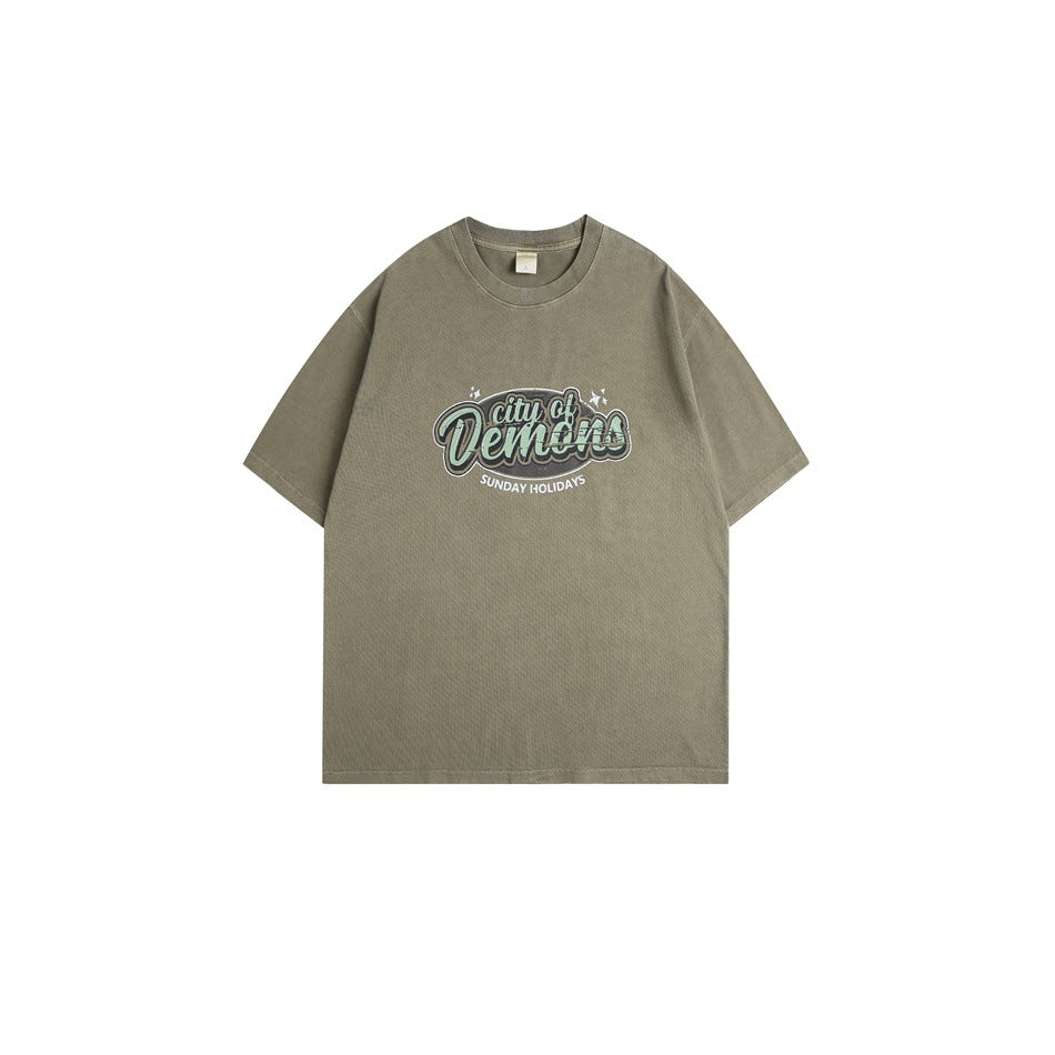 Army green washed short-sleeve T-shirt with green 'city of Demons' chest graphic, flat lay front view