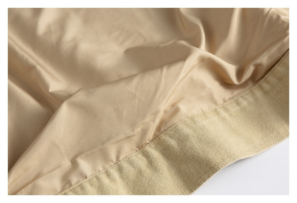 Close-up showing smooth beige lining beside the textured woven outer fabric.
