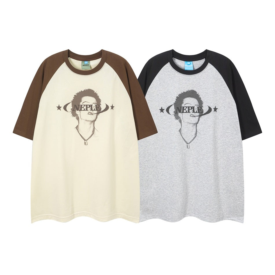 Two short-sleeve raglan T-shirts with portrait graphics: cream with brown sleeves and gray with black sleeves.