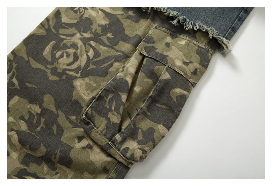 Close-up of an olive camouflage cargo pocket beneath a frayed blue denim layer.