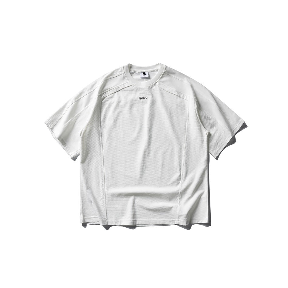 White short-sleeve crew-neck T-shirt with paneled seams and small chest print, flat lay front view