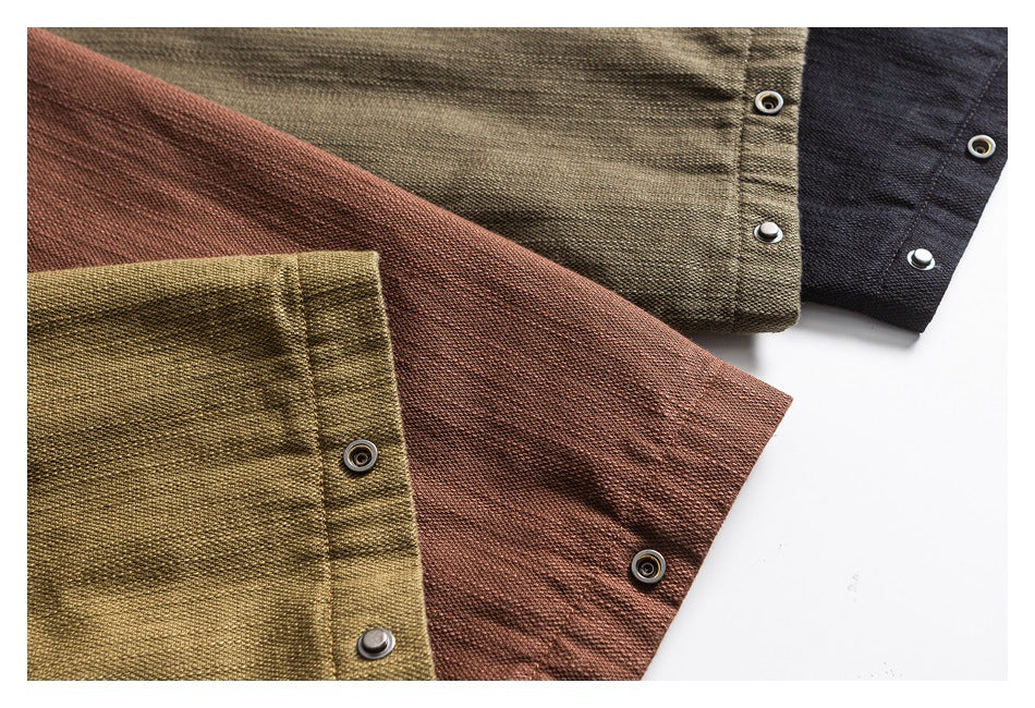 Close-up of jacket cuffs and metal snaps in olive, brown, and black colorways.