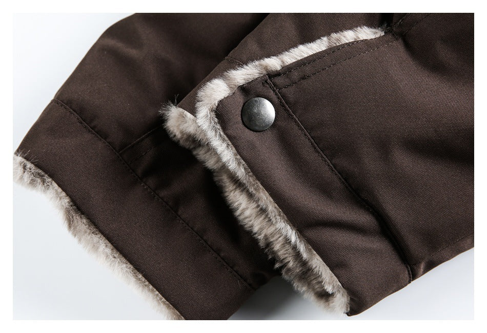 Brown garment edge with gray-brown faux-fur trim and a dark metal snap fastener.