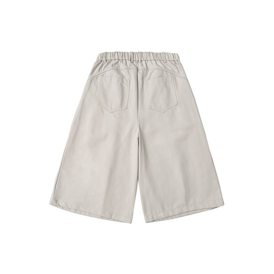 Off-white wide-leg knee-length shorts back view with elastic back waistband and two patch pockets, flat lay