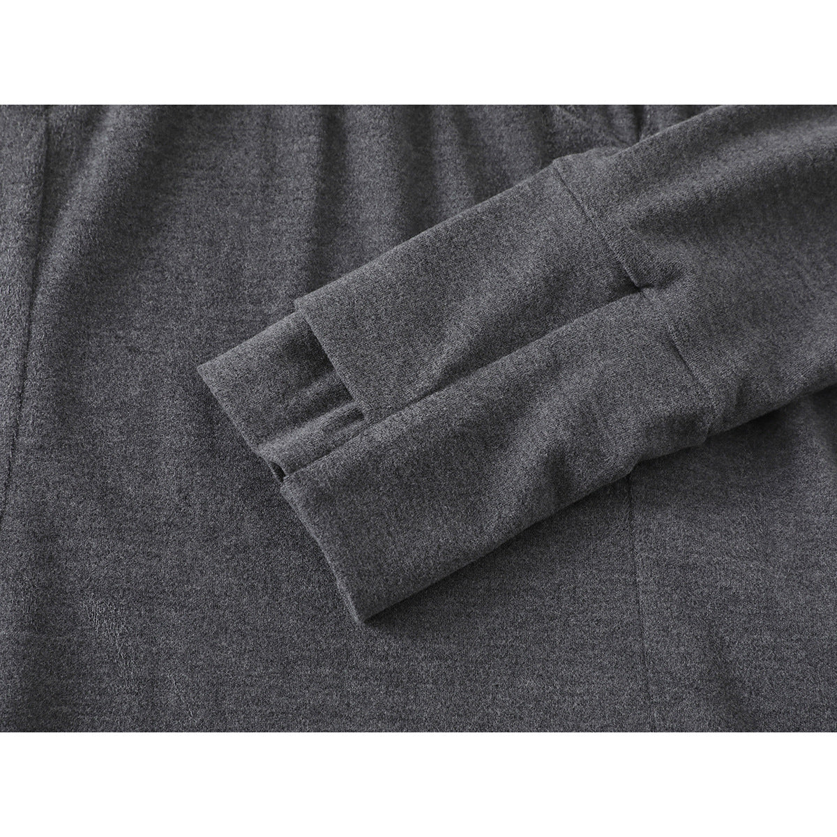 Close-up of a charcoal gray sleeve and cuff against the matching garment body.