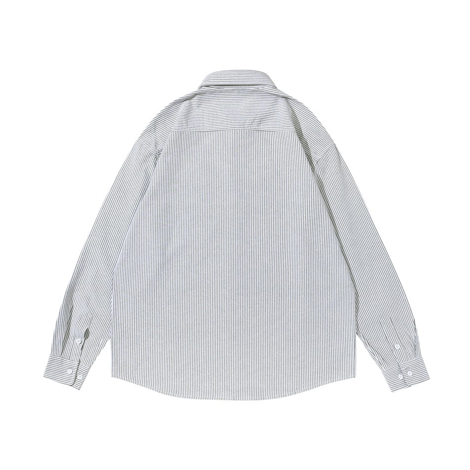 Back view of a white shirt with fine gray vertical stripes, a horizontal shoulder yoke, and long sleeves.