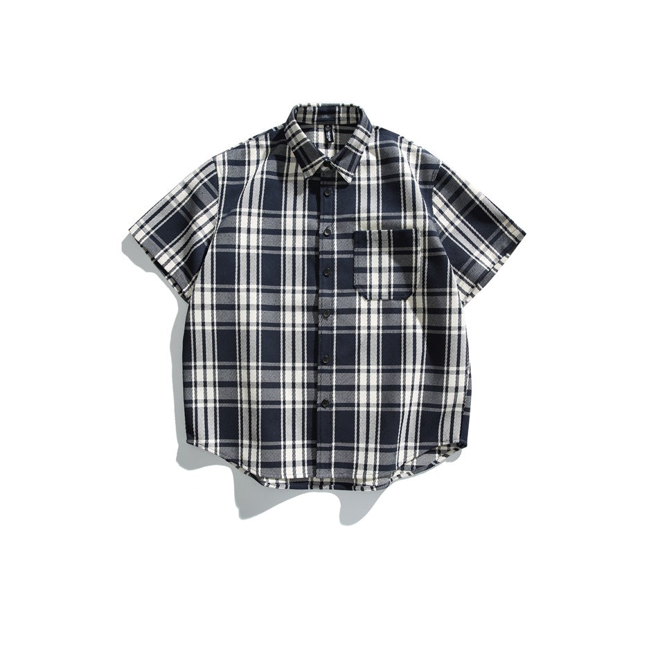 Navy and cream plaid short-sleeve button-up shirt with chest pocket, flat lay front view