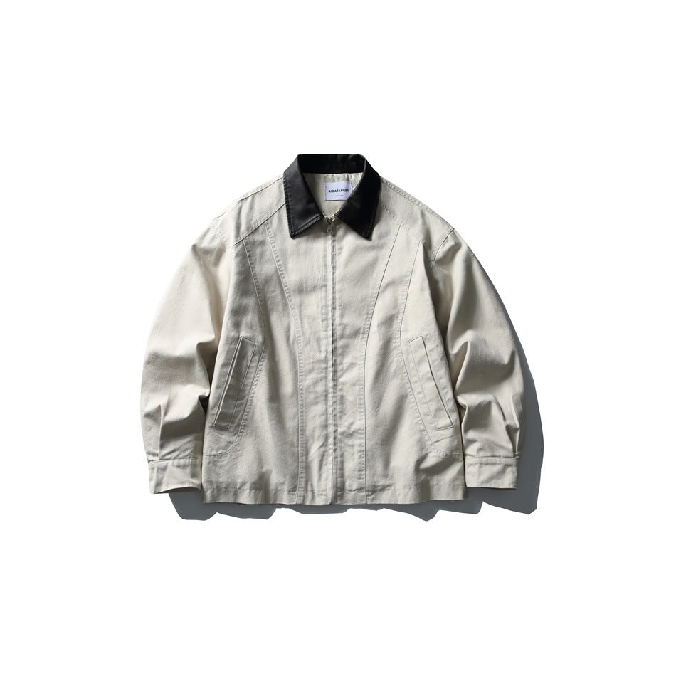 Beige zip-front jacket with black collar, slanted pockets and button cuffs, flat lay front view