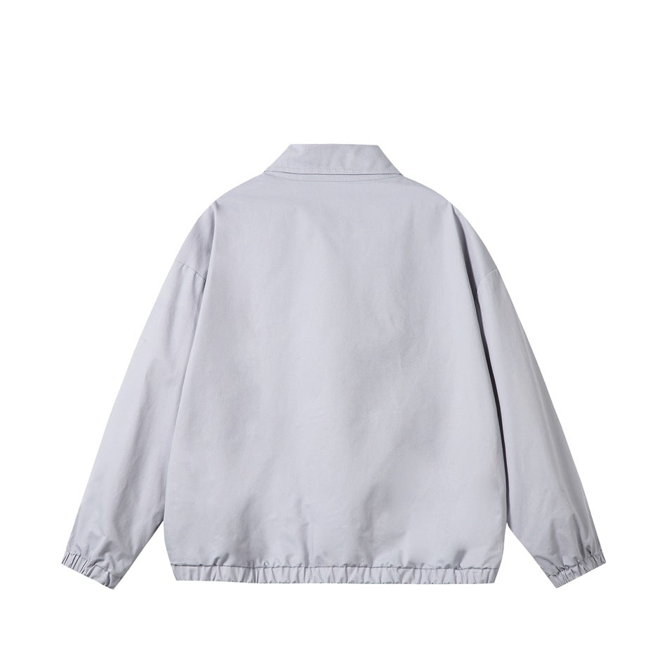 Back view of a pale gray collared jacket with long sleeves and gathered cuffs and hem.