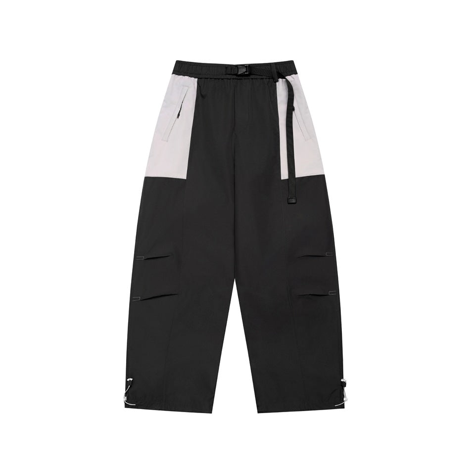 Dark gray wide-leg pants with light gray hip panels, black buckle belt, thigh pleats and drawcord hems, flat front view