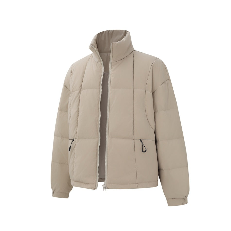 Front view of a light beige padded jacket with a tall collar, open zipper, and two zip pockets.