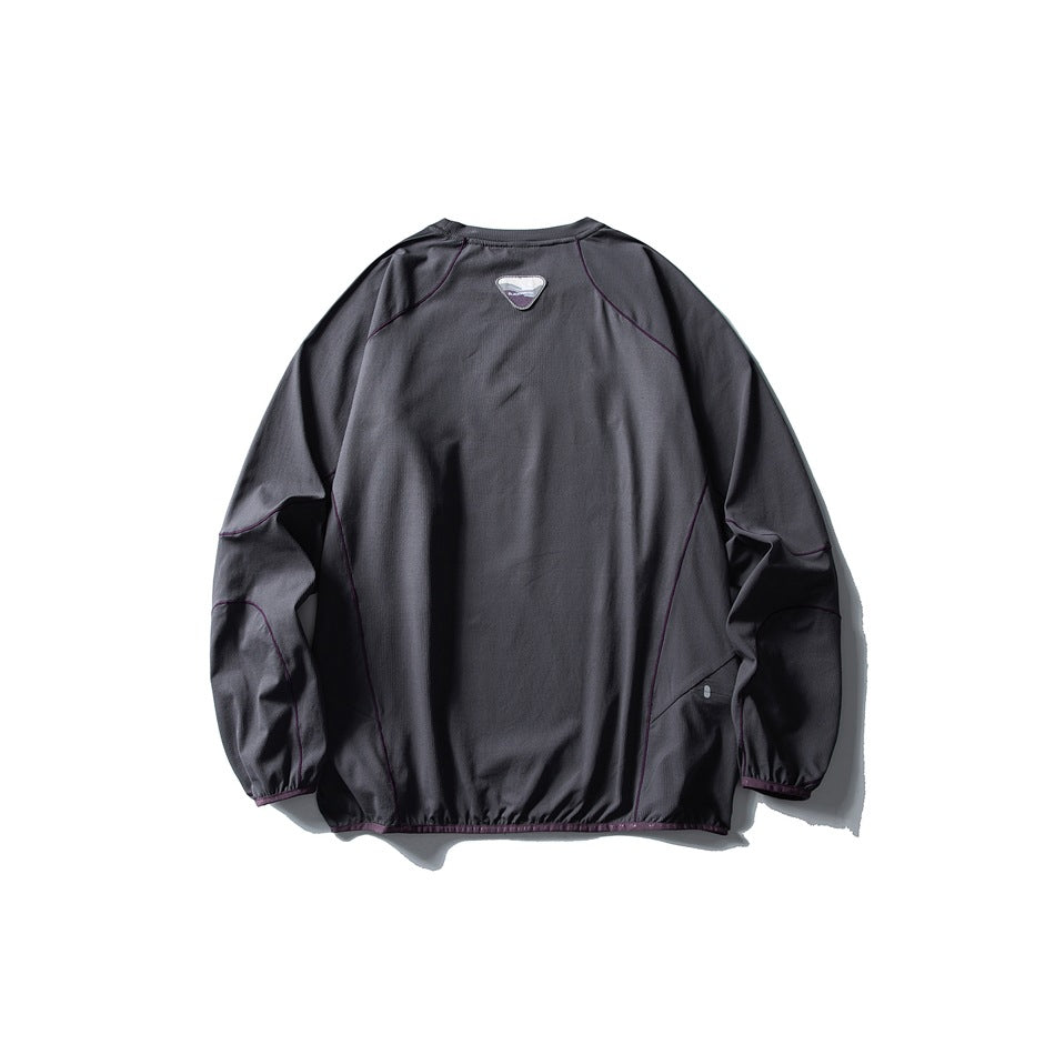 Back view of a charcoal gray pullover with long raglan sleeves and muted plum piping.