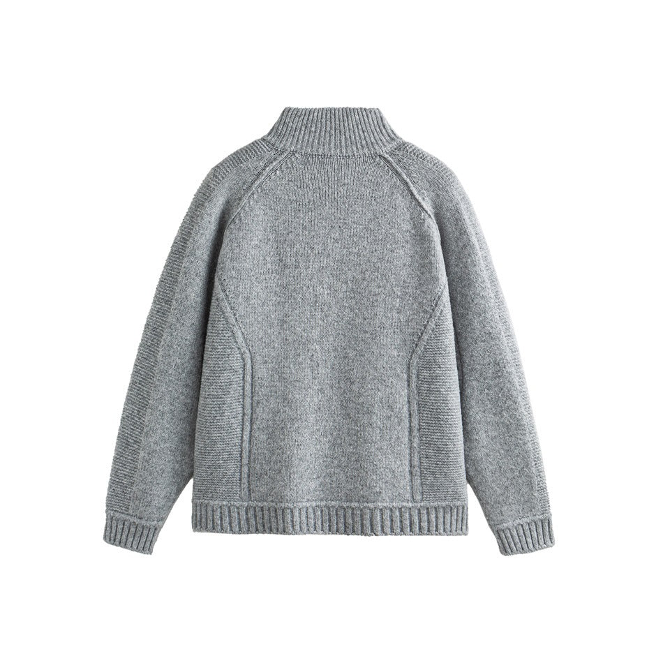 Back view of a light gray knit cardigan laid flat, showing raglan seams, ribbed side panels, and a stand collar.