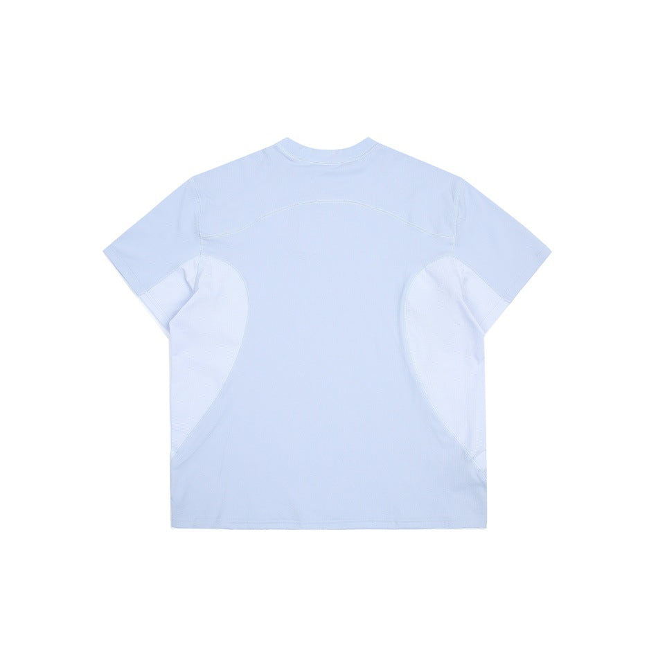 Back view of a pale blue short-sleeve crew-neck shirt with curved seam panels.