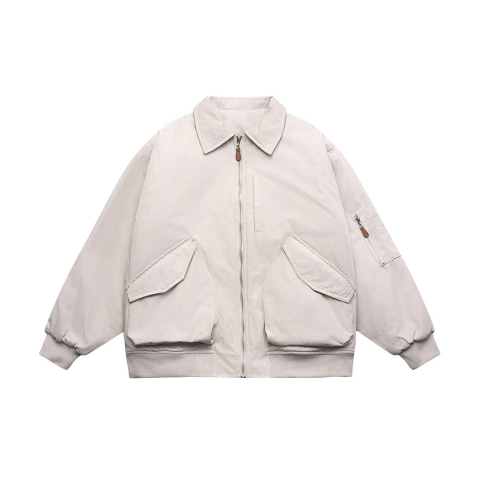 Light gray padded bomber jacket with pointed collar, front zip, flap pockets and ribbed cuffs, flat front view