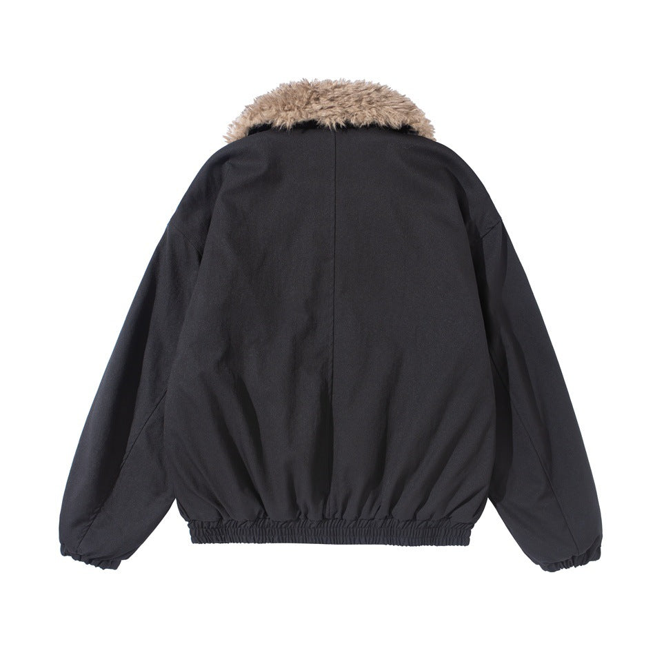 Back view of a black jacket with a shaggy tan collar, long sleeves and gathered hem and cuffs.