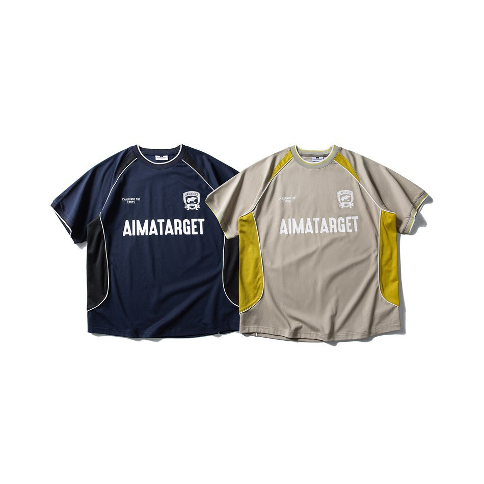 Two short-sleeve graphic T-shirts shown from the front: one navy and one taupe with yellow panels.
