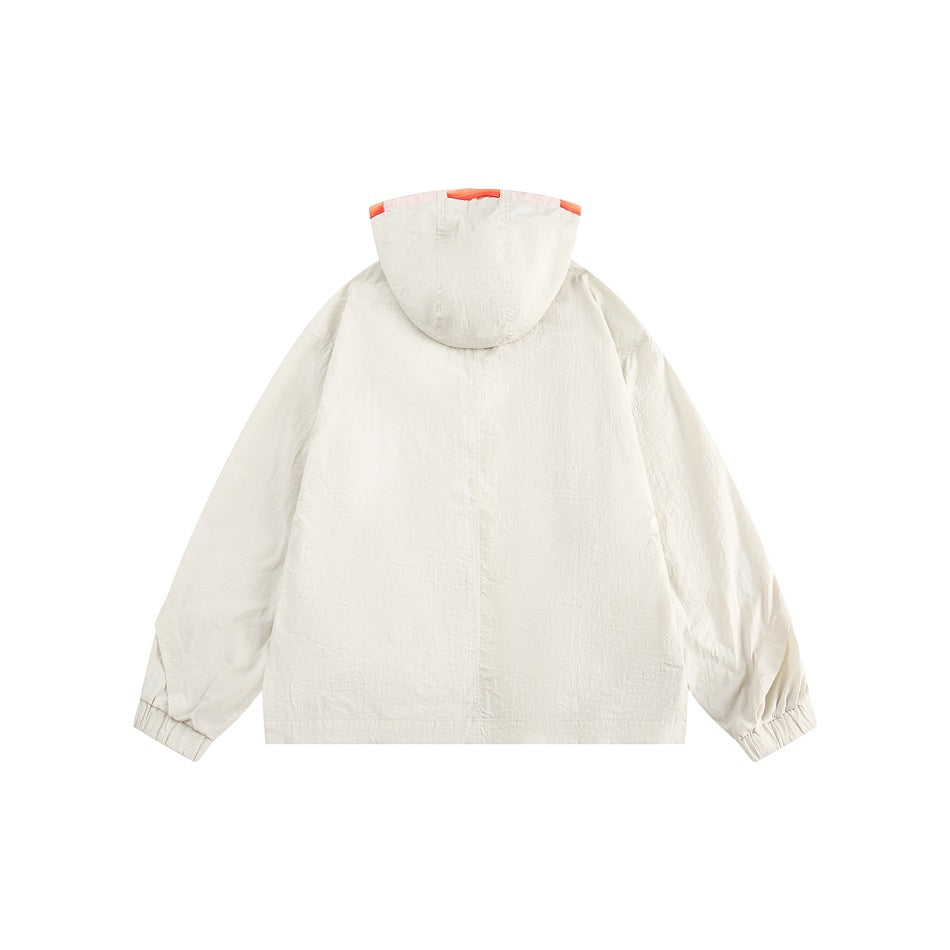Back view of off-white hooded jacket with orange hood trim and elasticized cuffs