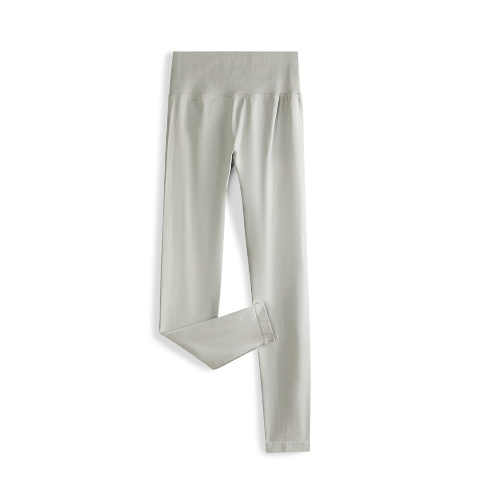 Light gray-green high-waisted ankle-length leggings laid flat with one leg folded