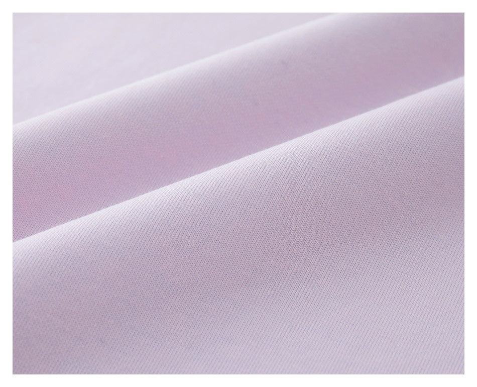 Close-up of pale lavender fabric with a fine, tightly knit texture and soft folds.