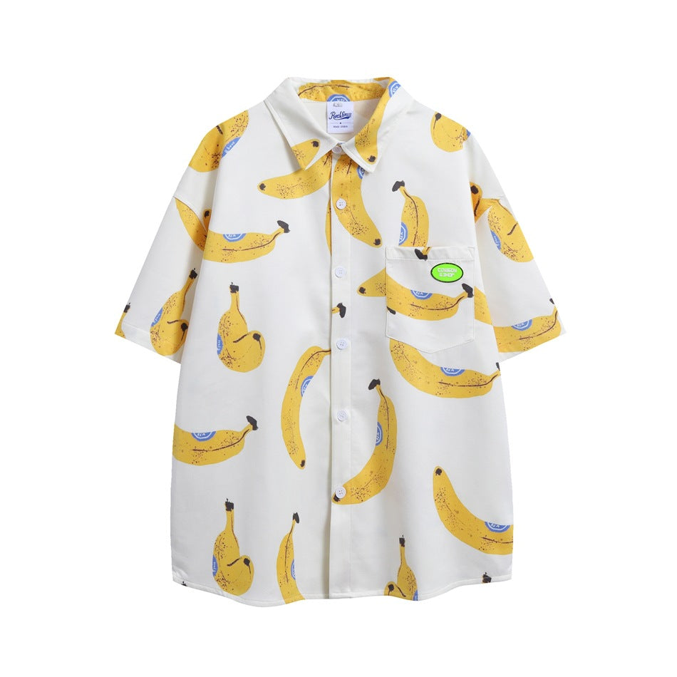 Front view of a white short-sleeve button-up shirt with yellow banana print, white buttons, and a chest pocket.