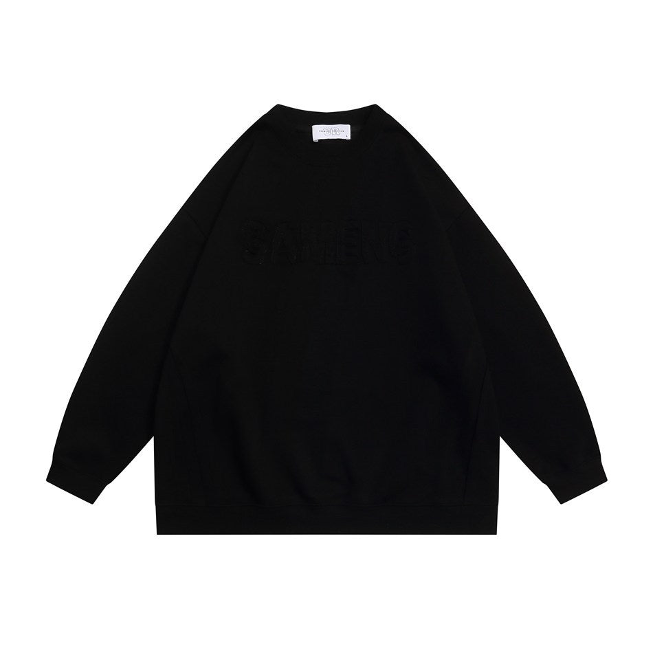 Black crew-neck sweatshirt flat lay with tone-on-tone chest lettering and ribbed cuffs and hem