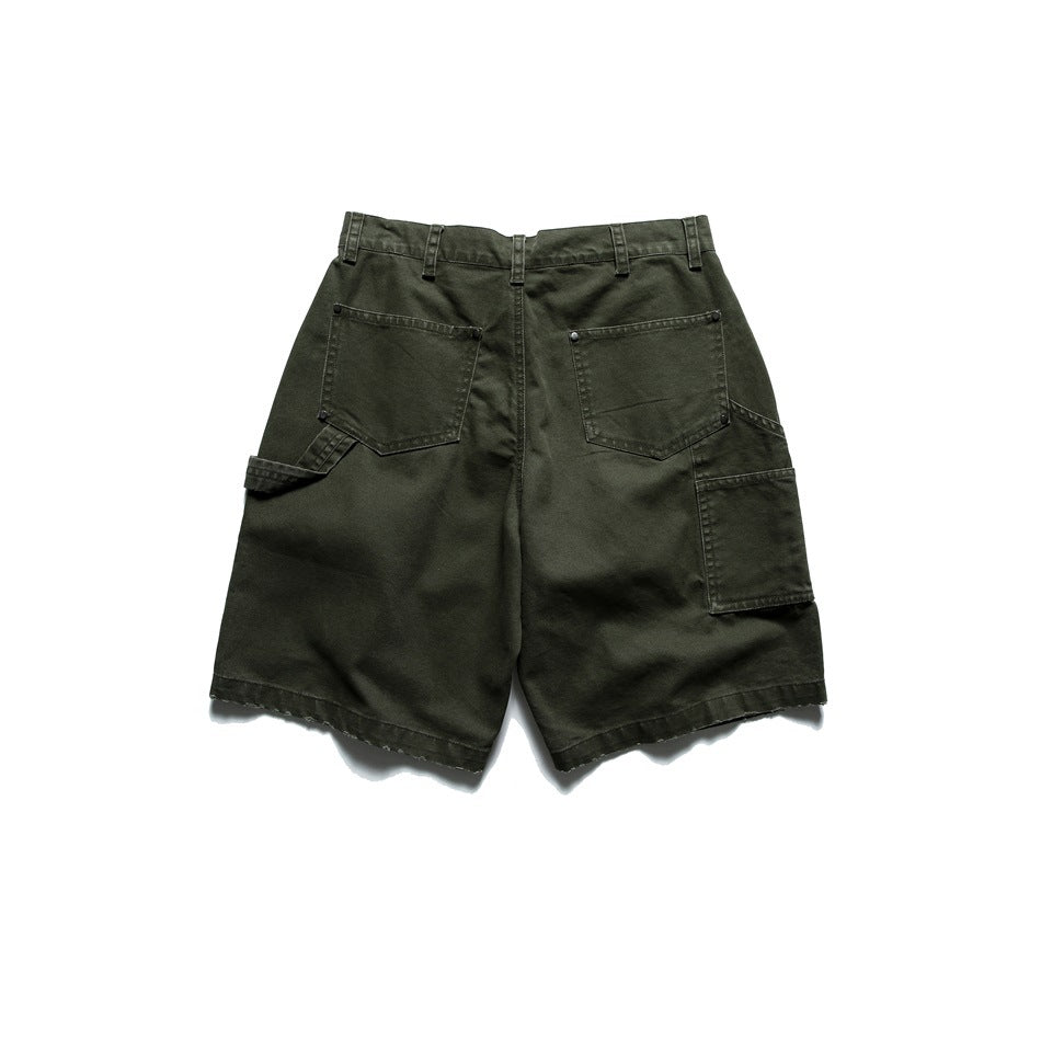 Back view of olive utility shorts with two rear patch pockets and a large side pocket.