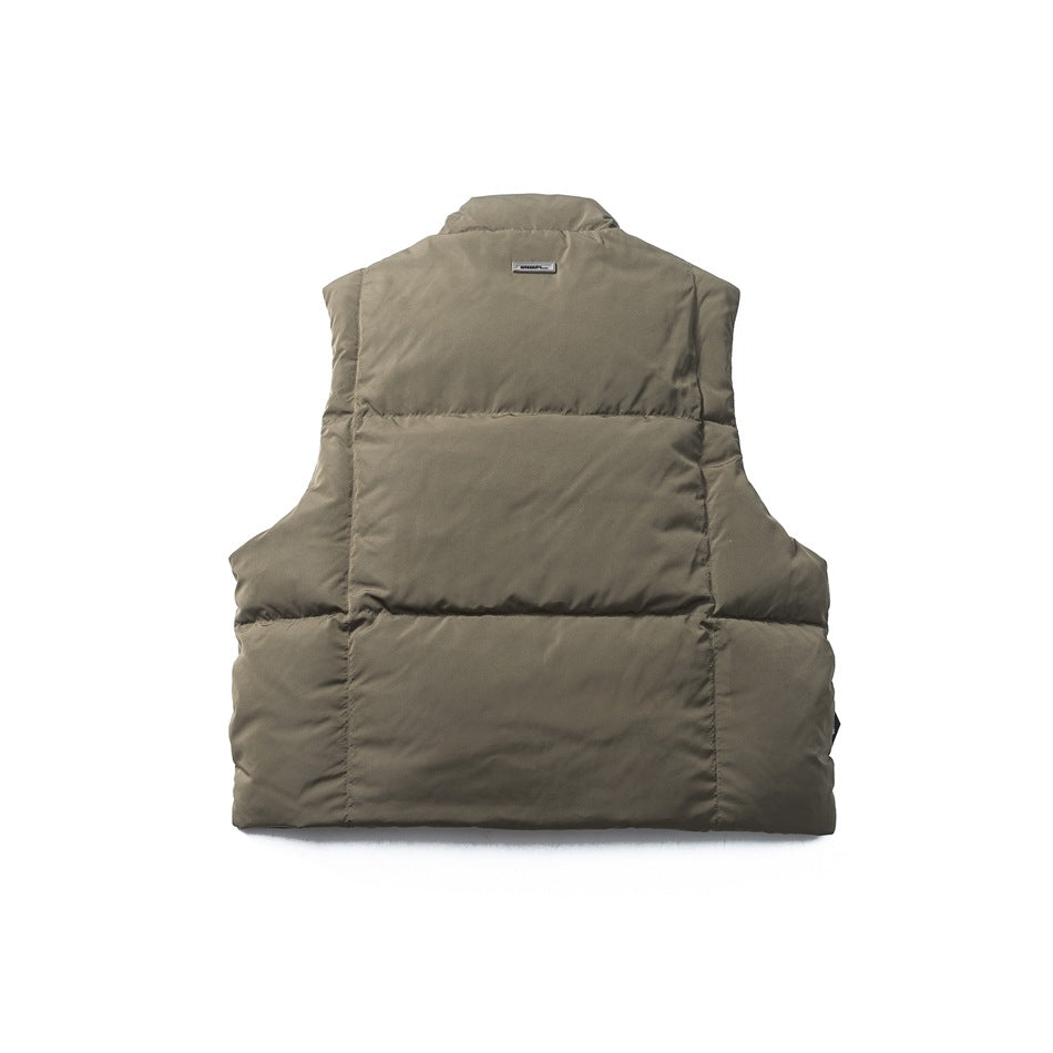 Back view of a taupe quilted sleeveless puffer vest with a short stand collar, shown against a white background.