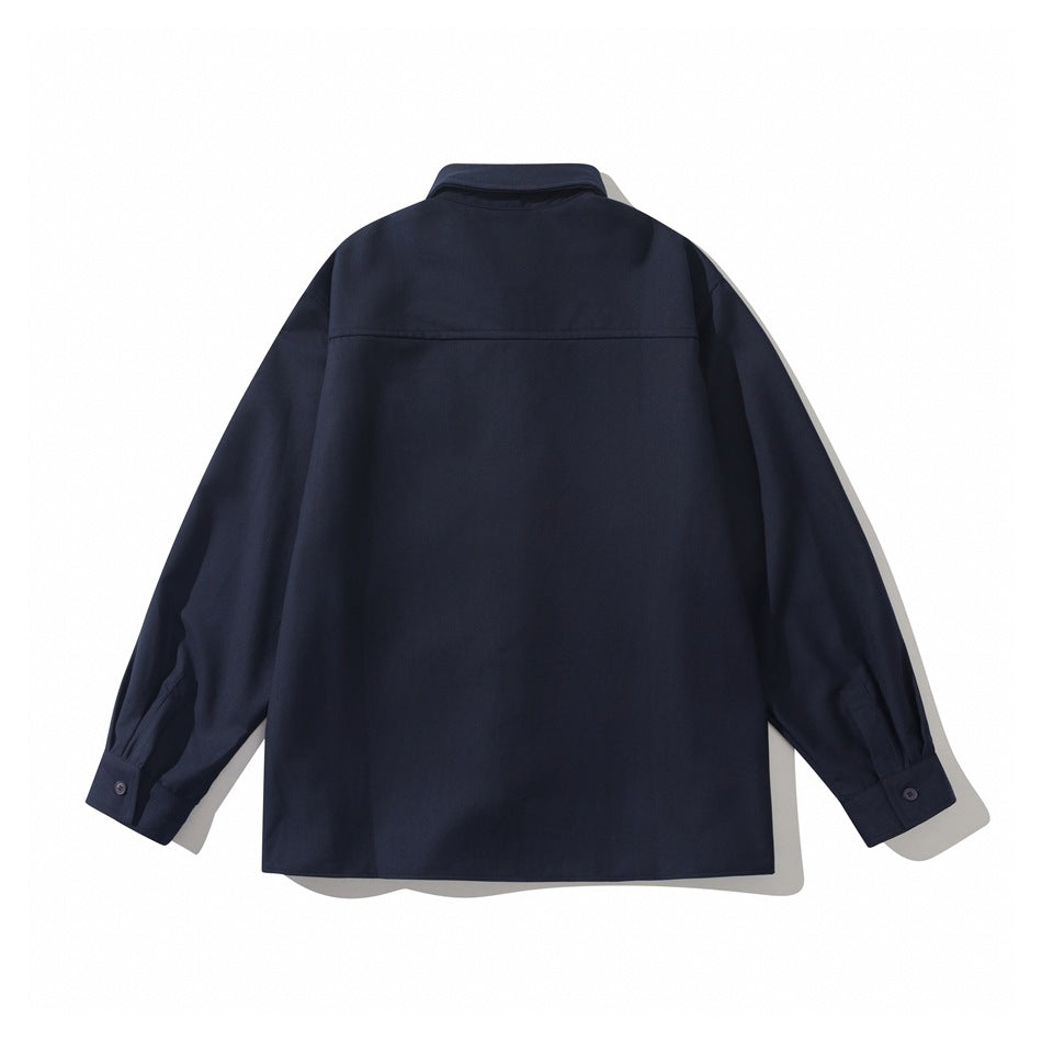 Back view of a navy long-sleeved button-up shirt with a horizontal yoke seam and button cuffs.