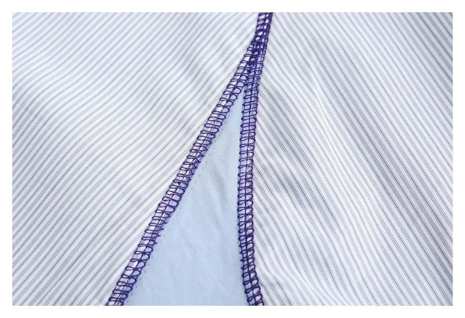 Close-up of white fabric with fine blue stripes and dark purple overlock stitching beside a pale blue panel.