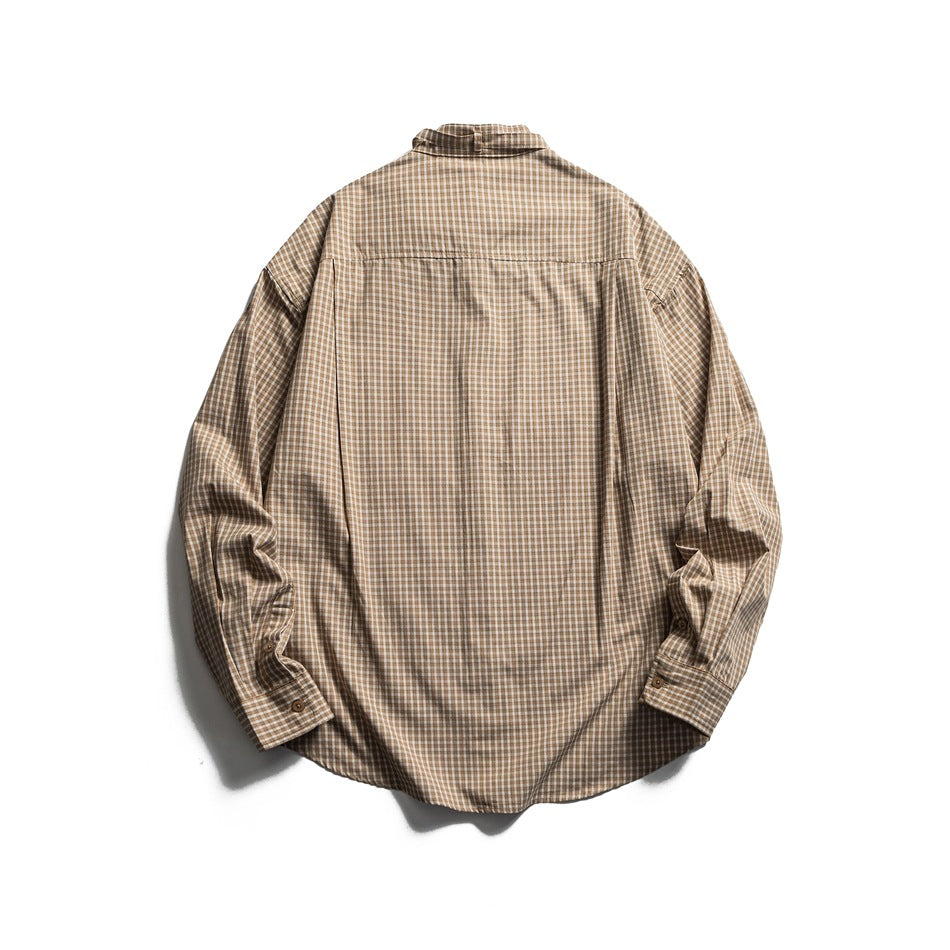 Back view of a tan and brown plaid long-sleeve shirt laid flat on a white background.