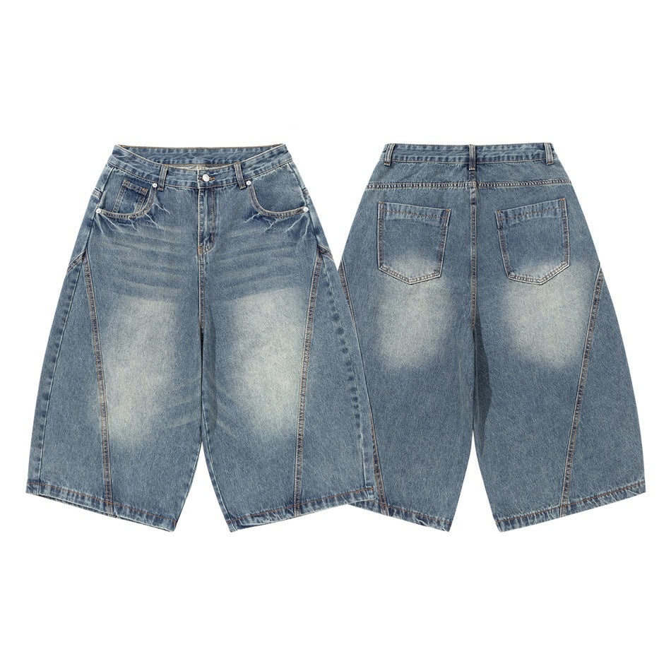 Blue washed wide-leg denim pants shown from the front and back, with curved front pockets and two rear patch pockets.