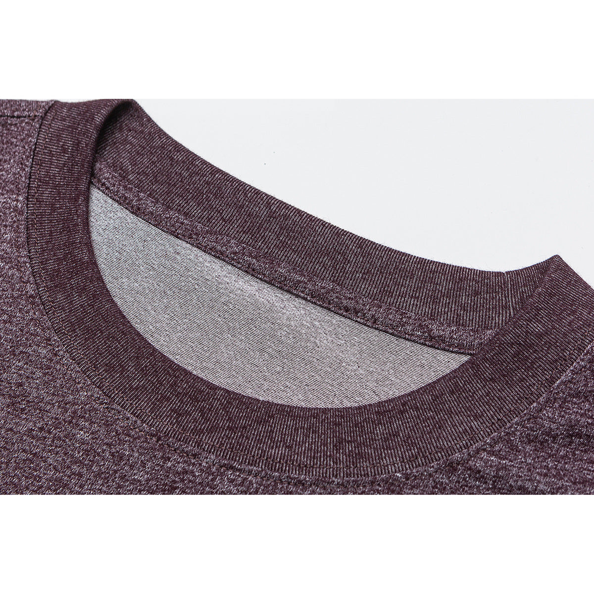 Close-up of a heather burgundy T-shirt's ribbed crew neck and inner collar.