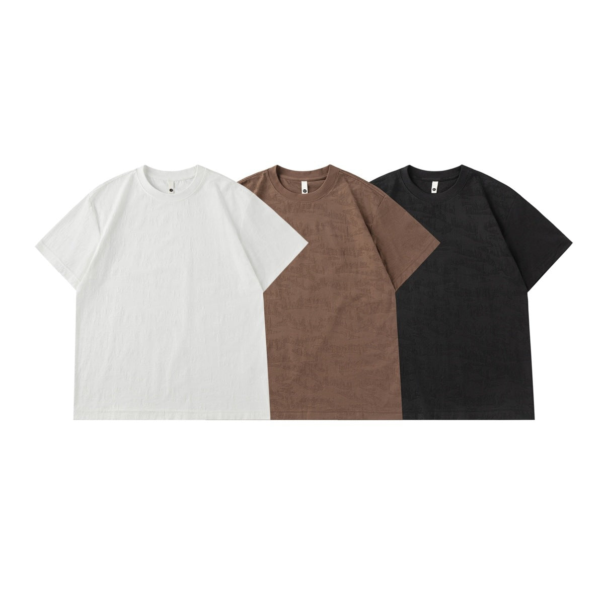 Three short-sleeve crew-neck T-shirts shown from the front in white, brown, and black.