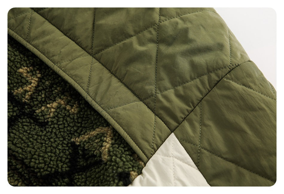 Close-up of olive diamond quilting, mottled fleece lining, and a cream contrasting panel.