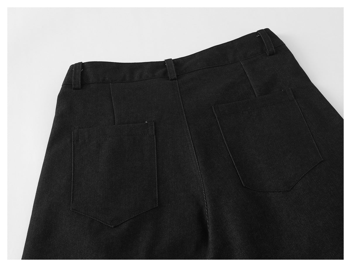 Back view of black trousers laid flat, with belt loops and two patch pockets.