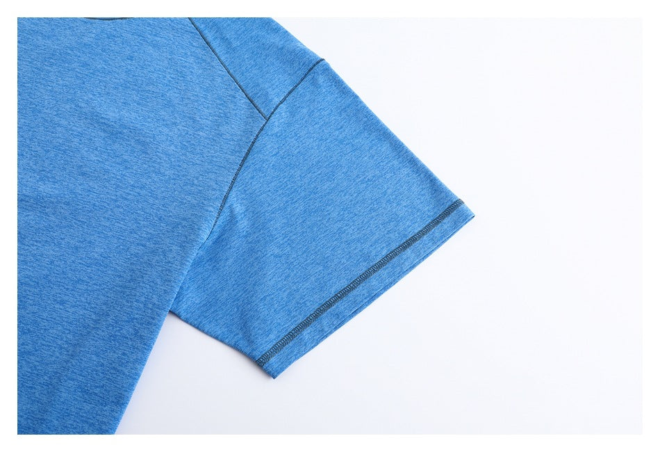 Close-up of a heather blue T-shirt sleeve showing the raglan seam and dark stitched hem.