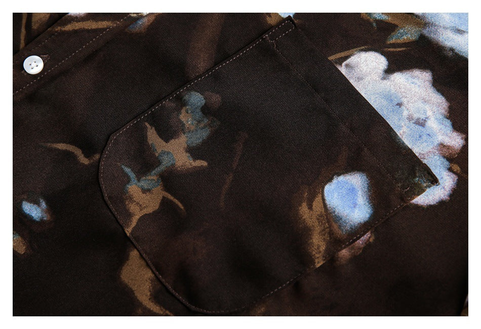 Close-up of a large patch pocket on the dark brown floral shirt.