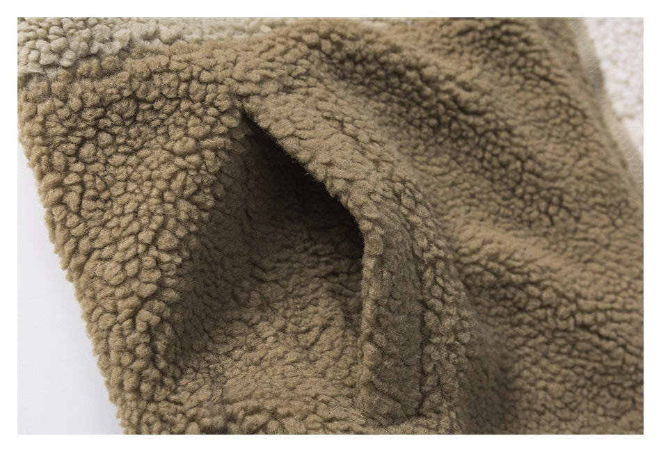 Close-up of a pocket opening in taupe-brown looped fleece, showing the deep fleece-lined interior.