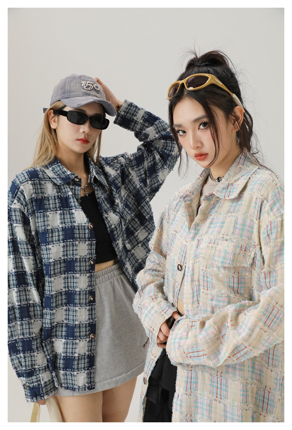 Two models show navy-and-white and cream pastel frayed plaid shirts in a closer view.