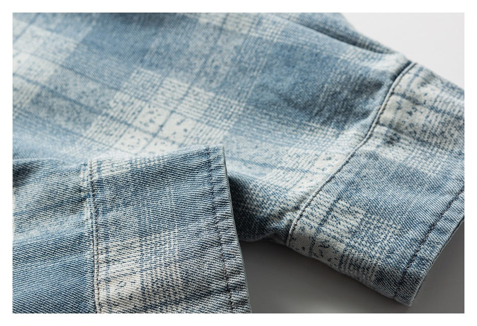 Close-up of a folded denim cuff and seam in a blue-and-white washed pattern.