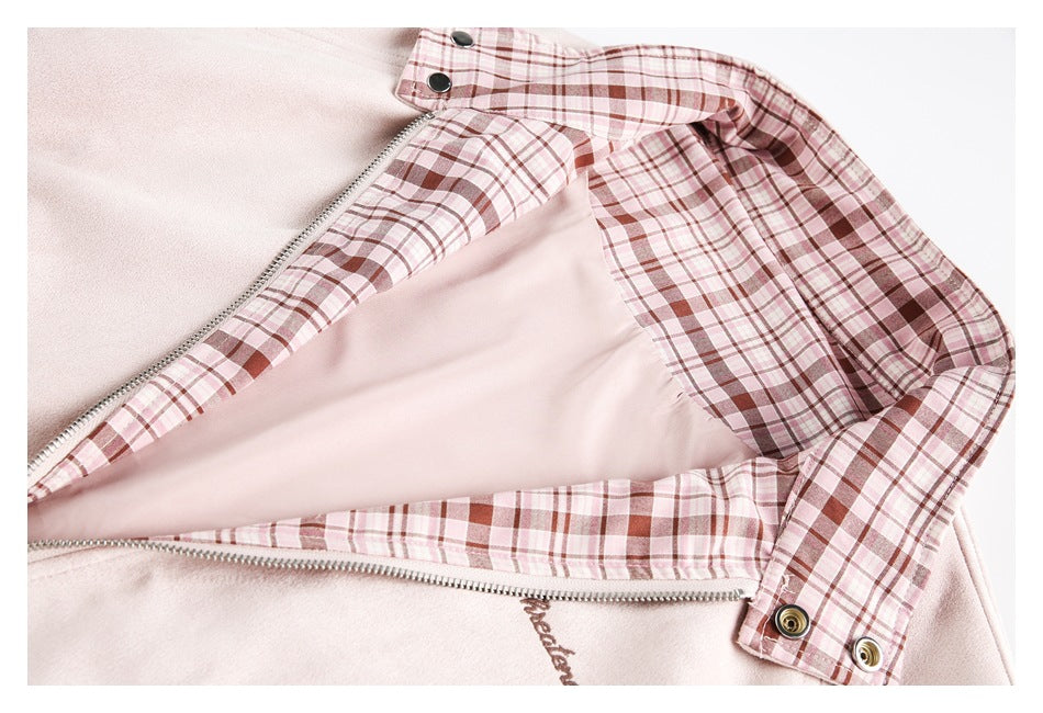 Pale pink jacket opened to show its pink-and-brown plaid lining and front zipper.