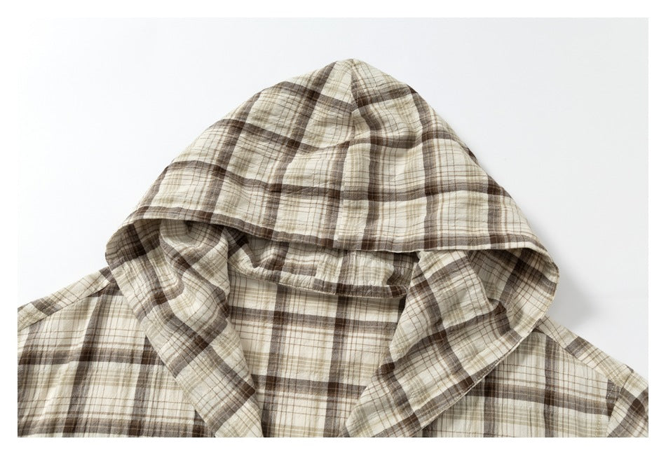 Close-up of the beige and brown plaid shirt's hood and neckline.