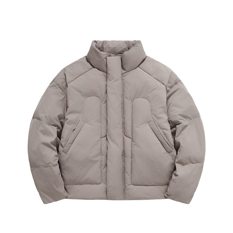Front view of a taupe padded jacket with a high stand collar, concealed closure, and angled pockets.