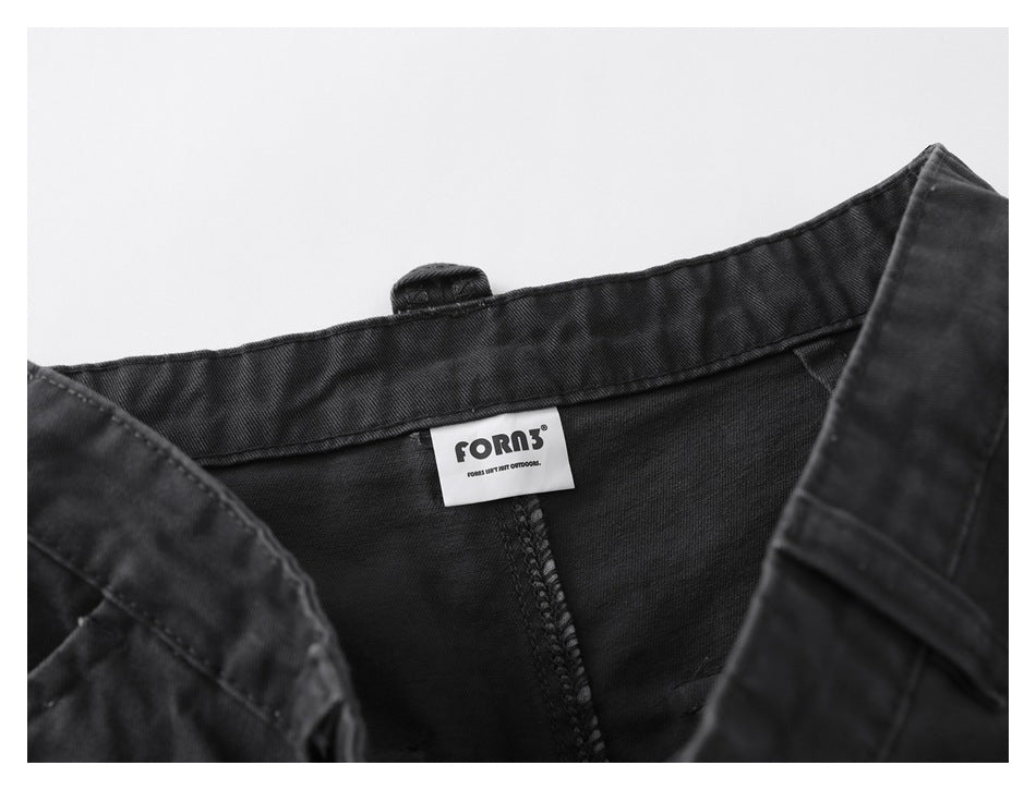 Inside waistband close-up showing a sewn brand label and the pants’ interior stitching.