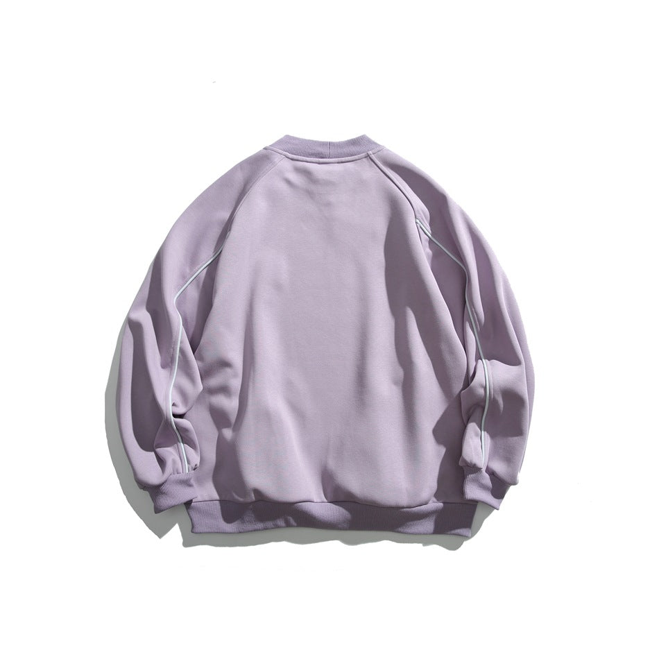 Back of a pale lavender crewneck sweatshirt with light piping along the raglan sleeves.