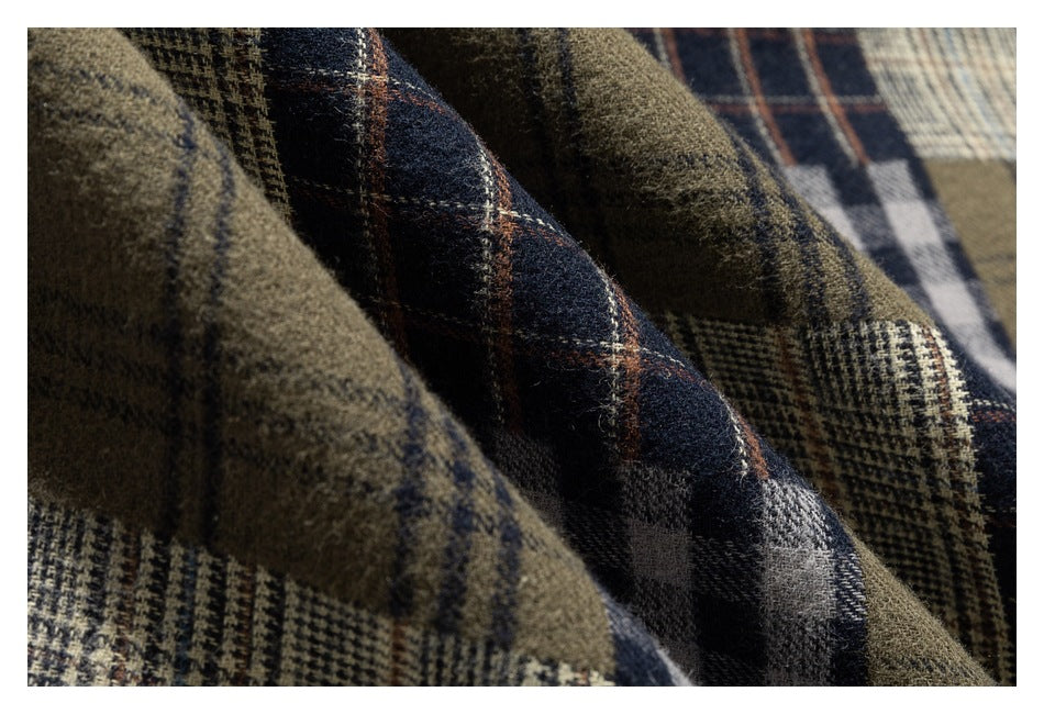 Macro view of the fuzzy surface and varied plaid pattern of a multicolor shirt.